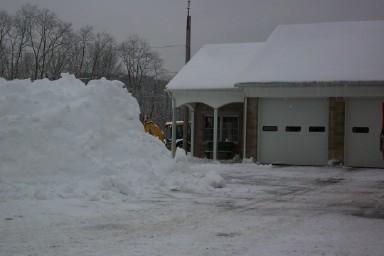 Borough Garage with large snow pile next to it
